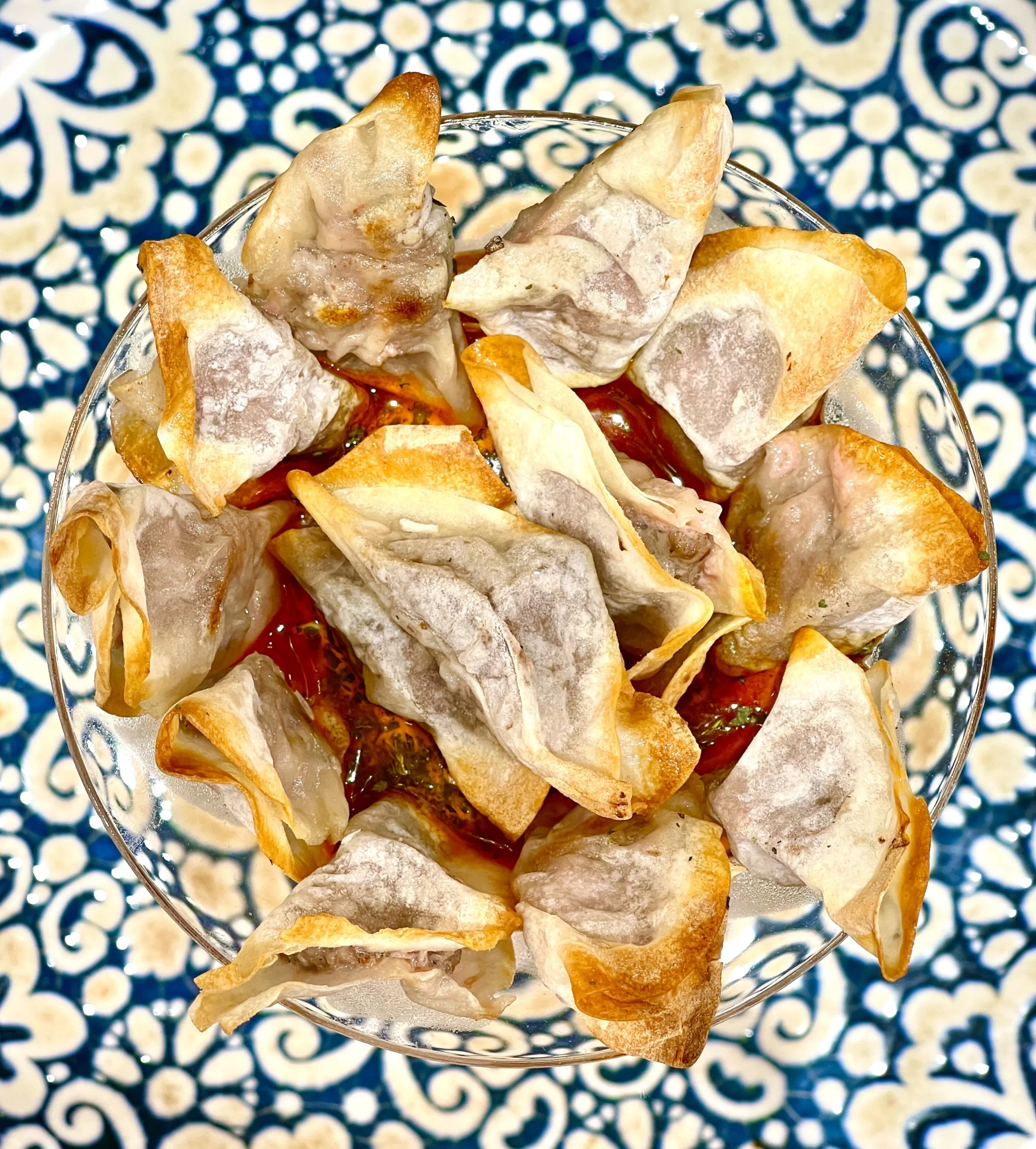 Oven-baked manti on an Iznik-pattern plate